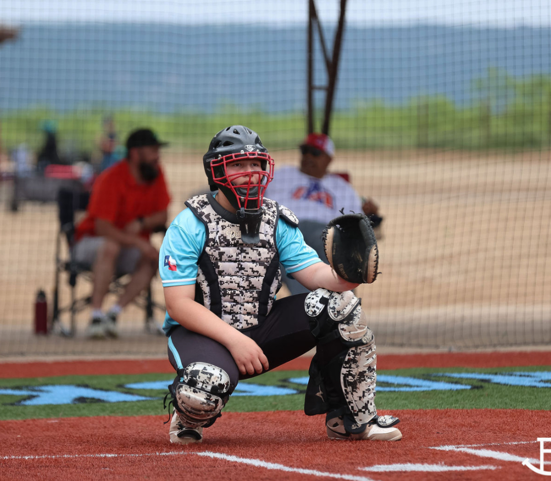 Alan Anchondo in full catching gear behind home plate